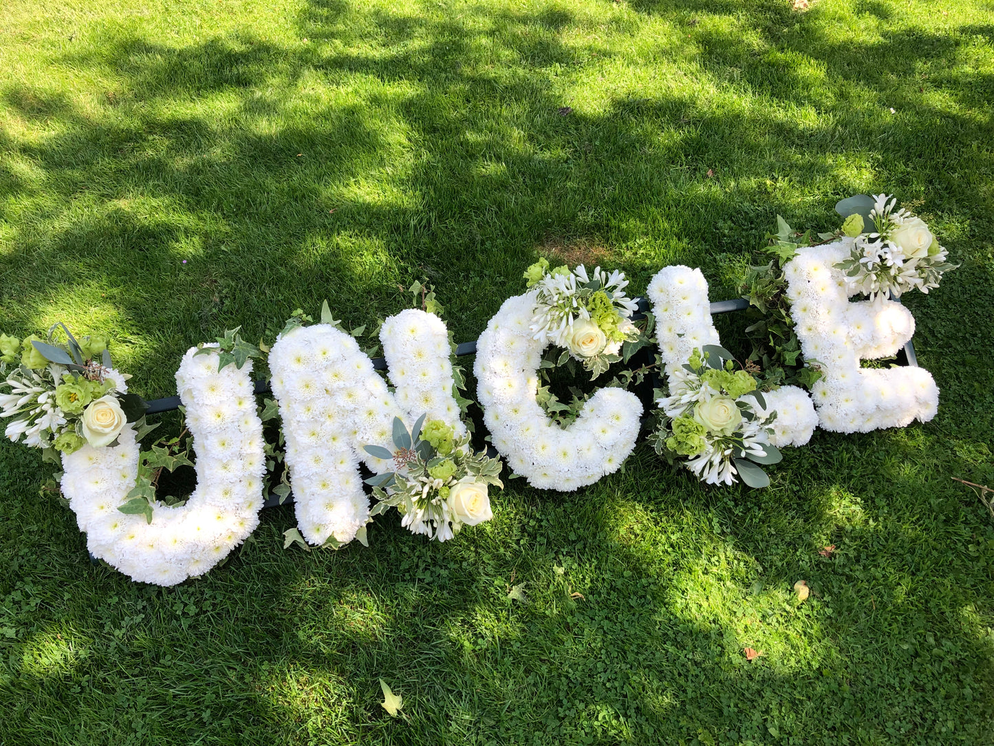 Letter tribute (crysanthemums)