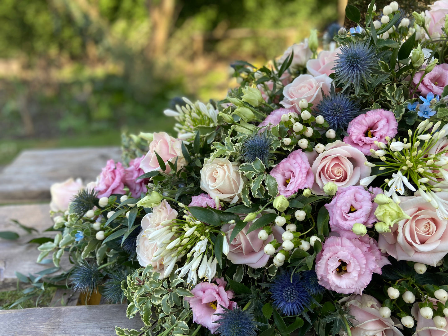 Casket Spray – Pink & Blue Funeral Tribute Flowers (Rose, Thistle & Agapanthus)