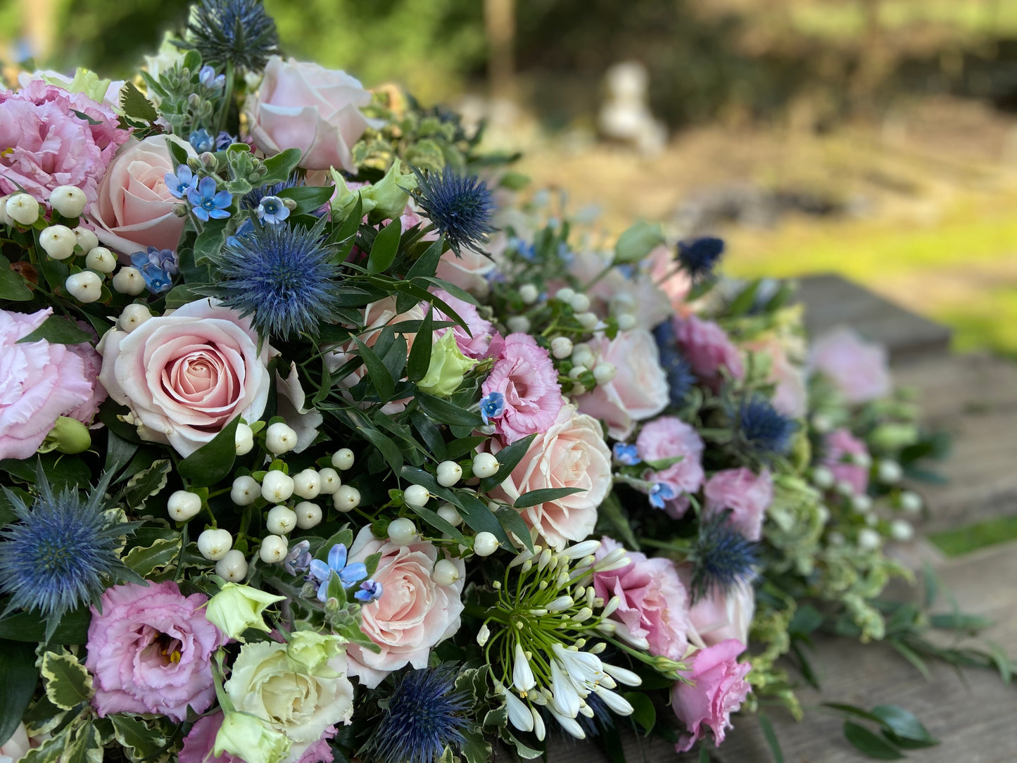 Casket Spray – Pink & Blue Funeral Tribute Flowers (Rose, Thistle & Agapanthus)