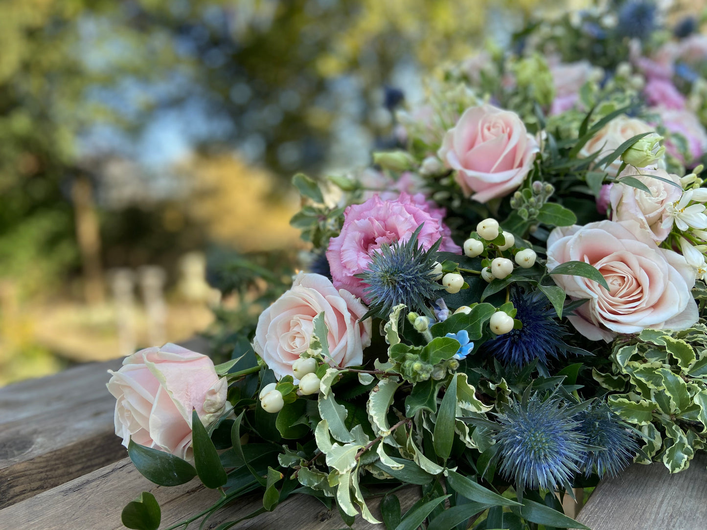 Casket Spray – Pink & Blue Funeral Tribute Flowers (Rose, Thistle & Agapanthus)