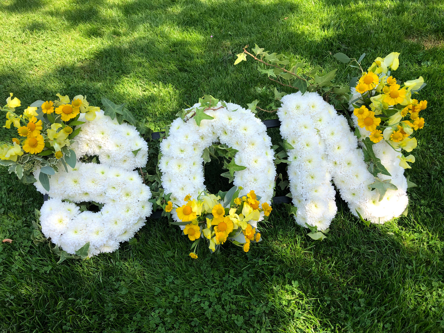 Letter-Shaped Funeral Tribute – Son